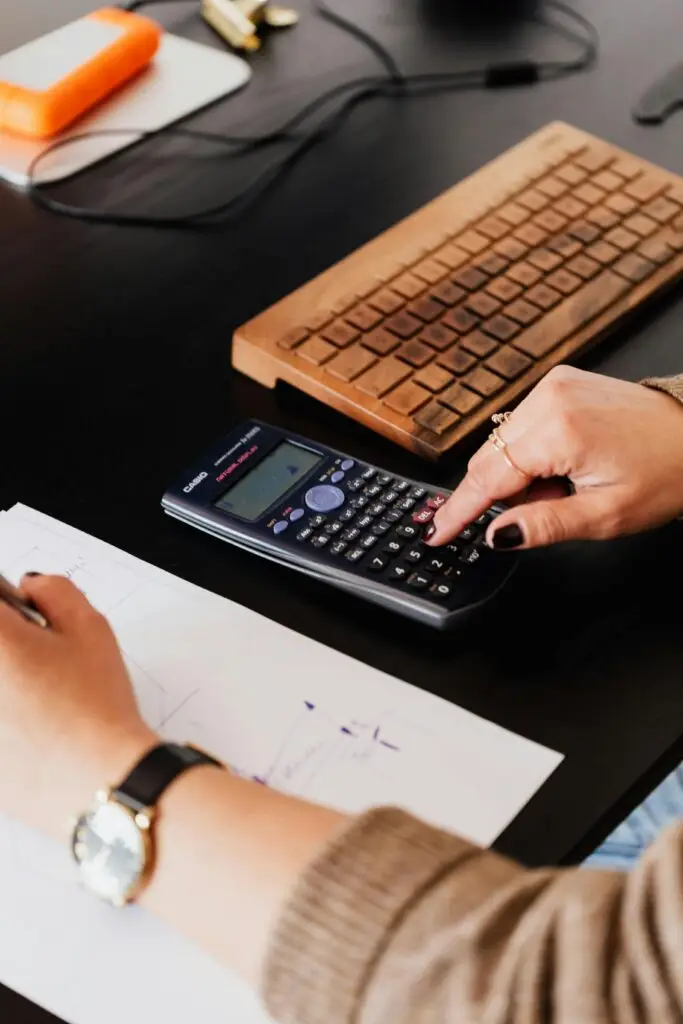 A producer at their desk working out voiceover pricing costs